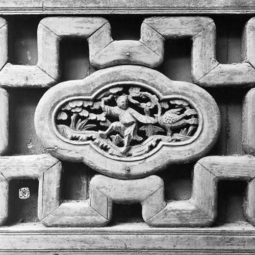 parapet with traditional folklore wood carvings